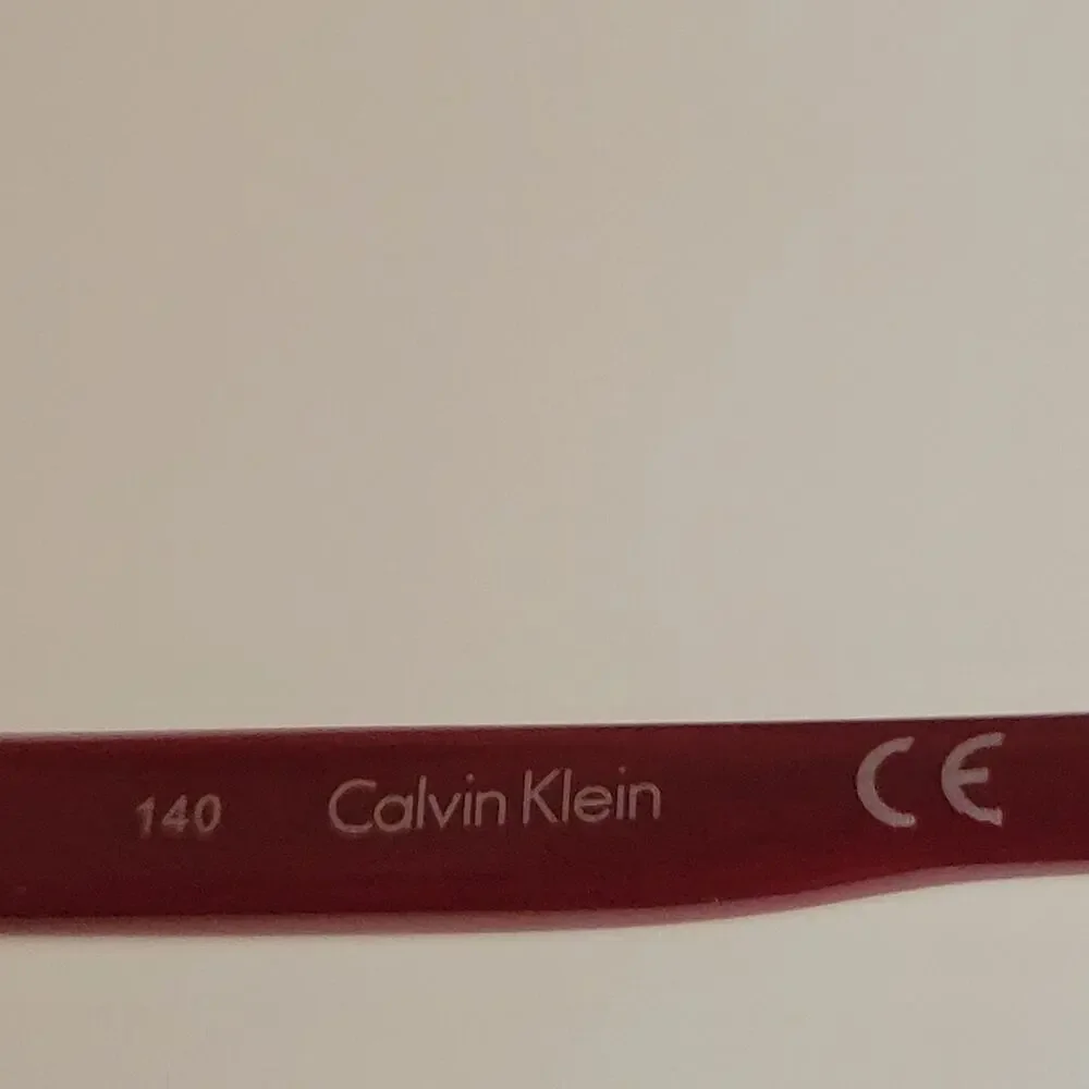 Calvin Klein CK59561 model featuring a black and red frame design 53X17X140